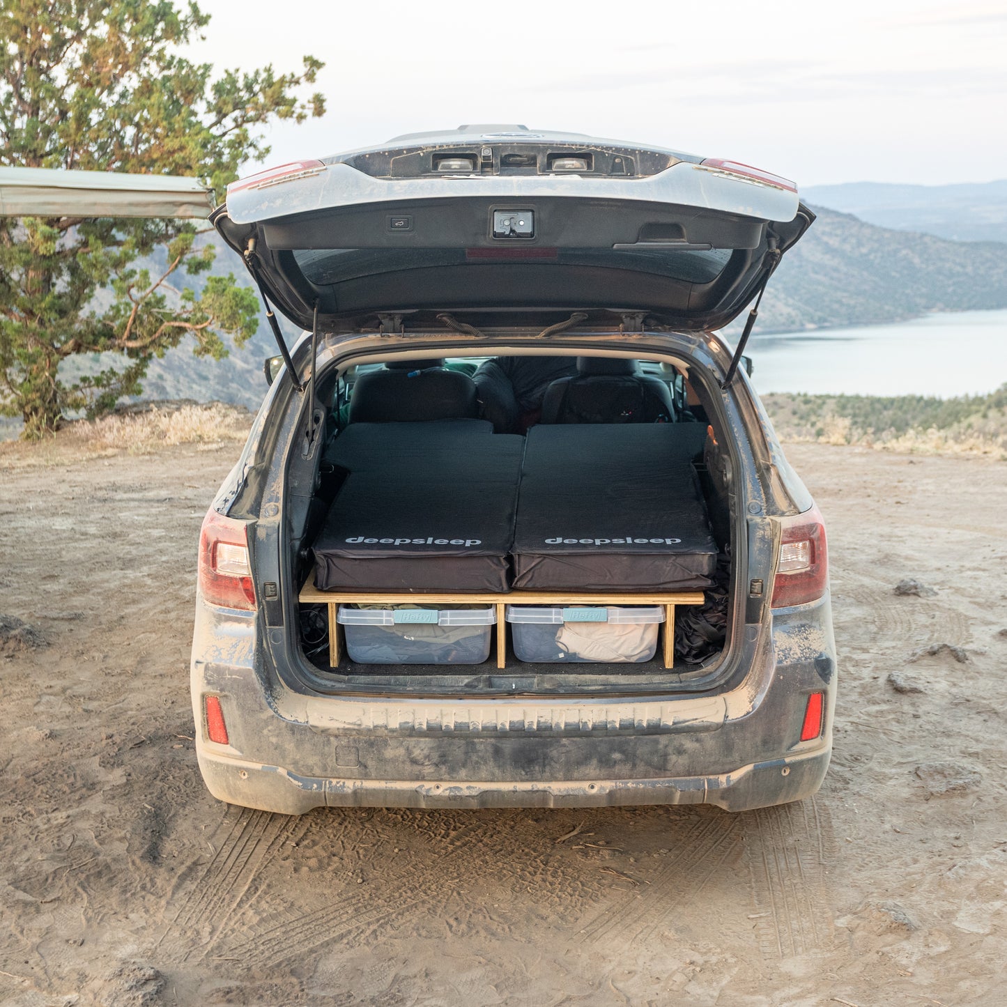 The trunk of a Subaru Outback with a Deepsleep Solo Mat by CarToCamp in it.