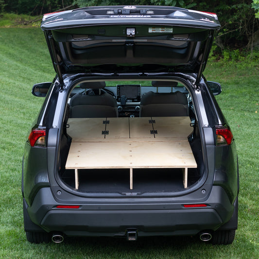 A CarToCamp RAV4 with a Toyota RAV4 Sleeping Platform in the trunk for additional storage space.