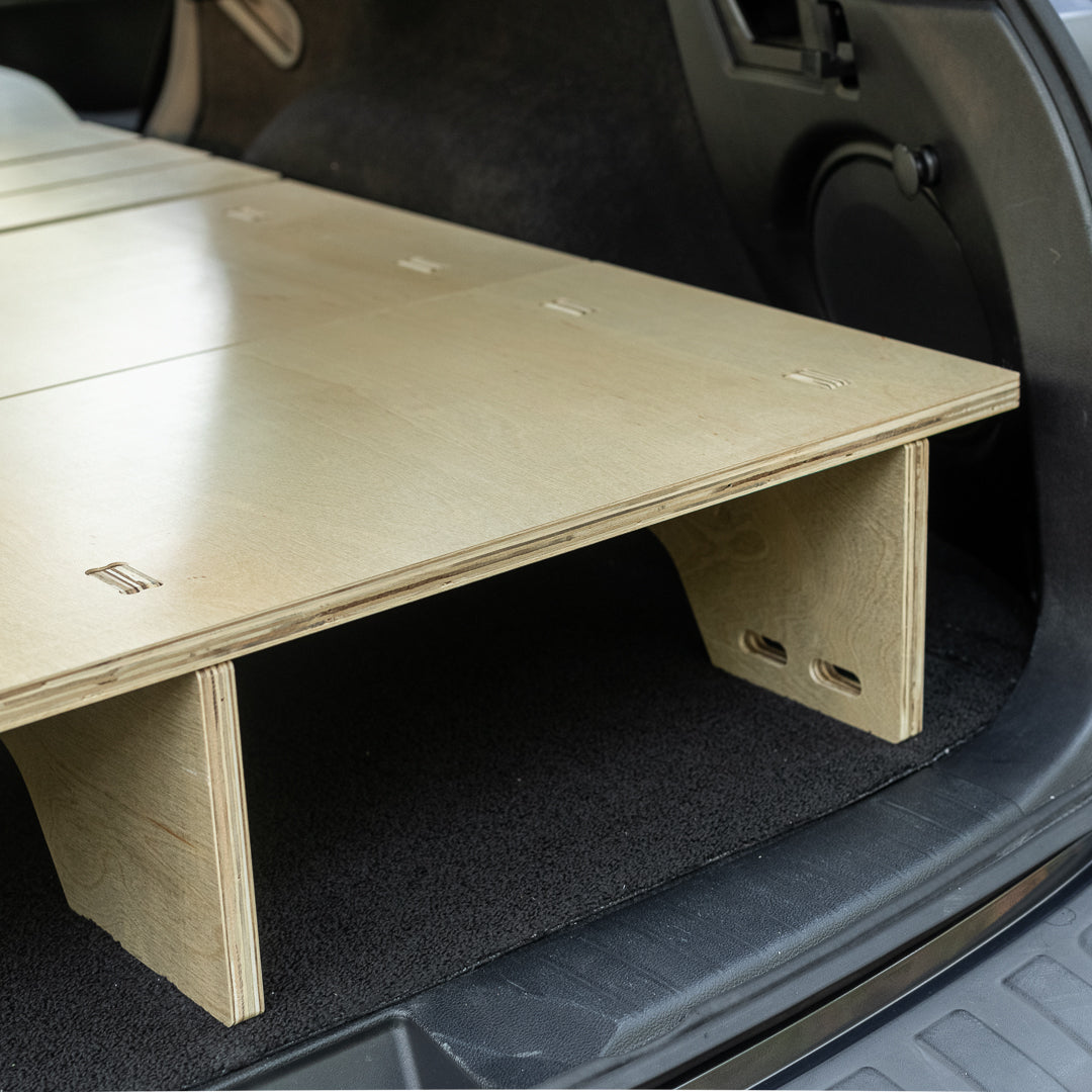 A CarToCamp Subaru Outback Sleeping Platform providing access to storage space in a Subaru Outback trunk.